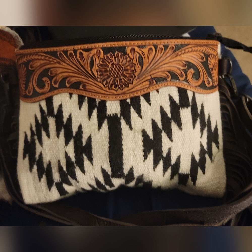 American Darling brand new! Beautiful saddle blanket and tooled leather bag.